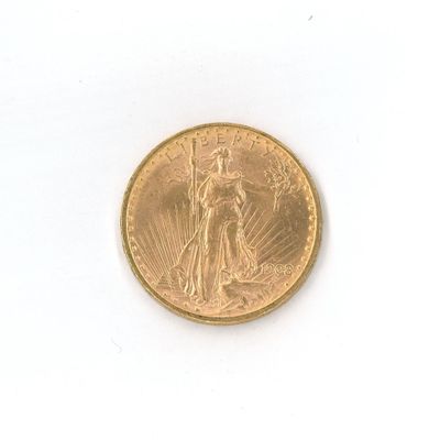 une image d'une pièce d'or sur une surface blanche