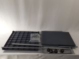 a laptop computer sitting on top of a white table