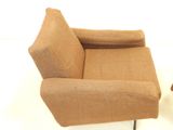 a chair that is sitting on a white surface