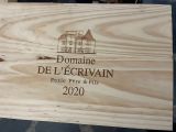 a wooden box with a picture of a house on it