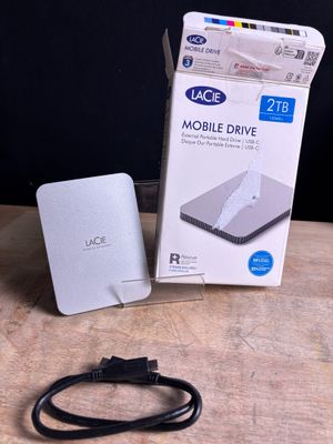 a white box with a cable attached to it on a table
