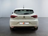 the rear end of a white car in a white room