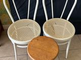 two chairs and a table in a room
