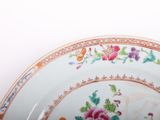 a close up of a plate with flowers on it