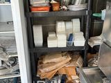 a small kitchen with a lot of items on the shelves