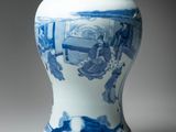 a blue and white vase sitting on a table