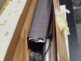 a cardboard box with a roll of tape on top of it