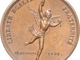 an image of a bronze medal with a woman holding a tennis racquet