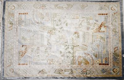 an old rug with a design of birds and flowers on a white background