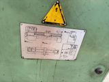 a sign on the side of a machine that has a warning sign on it