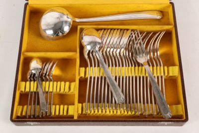 a yellow box with silverware in it on a white surface