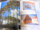 an open book with a picture of a landscape in it