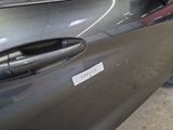 a close up of a car door handle with a sticker on it