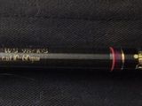 an old baseball bat laying on top of a black cloth