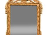 an image of a mirror with a gold frame on a white background