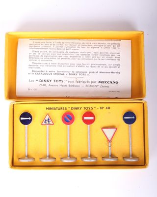a yellow box with a set of miniature road signs in it