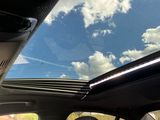 a view of the sky from inside of a car