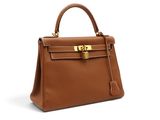 a brown leather handbag on a white background