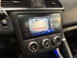 the dashboard of a car with a gps device in the center
