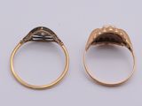 an image of two gold rings with black diamonds on them