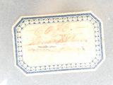 a small box with writing on it on a table