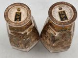 pair of asian vases with gold and blue designs on them