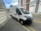 a white van that is parked on the side of the street