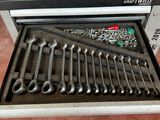 a tool box with tools in it sitting on the floor