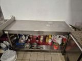 a kitchen with a stainless steel counter and a sink