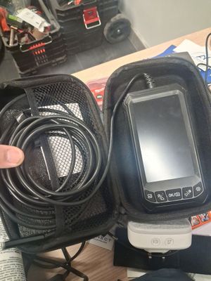 a person holding a cell phone in a case