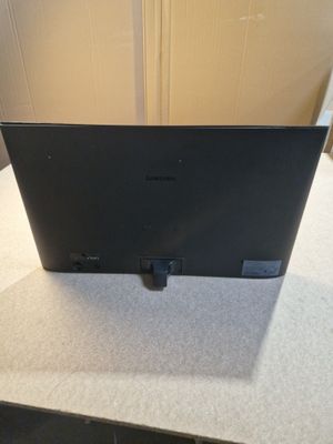 the laptop is sitting on the table with its lid open