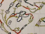 a picture of a table cloth with a bunch of scissors on it