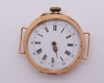 a gold pocket watch with roman numerals on the face