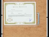 a picture of a picture of a certificate on a bulletin board