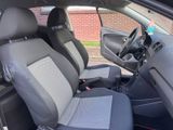 the interior of a car with two seats and a steering wheel