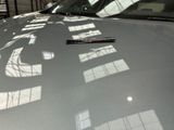 a car that has a sticker on the hood of it