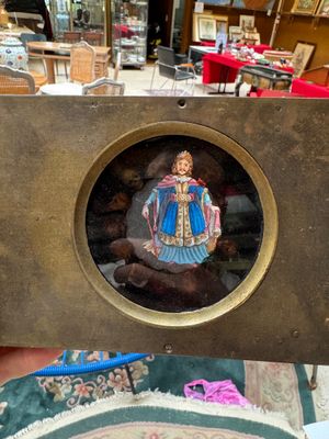 a picture of a picture of a woman in a dress in a frame