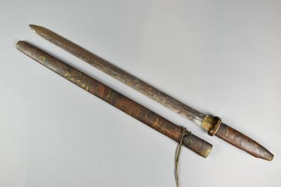 pair of antique wooden and brass - plated swords with brass - plated handles