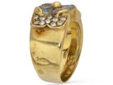 a close up of a gold ring with diamonds on a white background