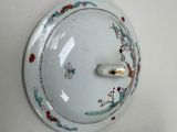 two plates and a bowl on the wall next to each other