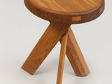 an image of a small wooden stool with two legs on a white background