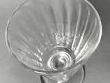 a glass vase that is sitting on top of a table