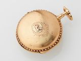 an image of a gold pocket watch on a white surface