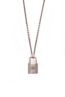 a necklace with a lock on a chain on a white background