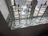 several empty wine glasses sitting on a window sill in front of a window