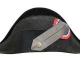 pirate hat with red, white, and blue ribbon on it