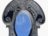a picture of a mirror with a blue sky in it