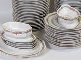 a lot of plates and cups on the table