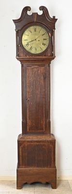 a grandfather clock that is standing in the corner of the room