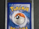 a close up of a pokemon card in a plastic case
